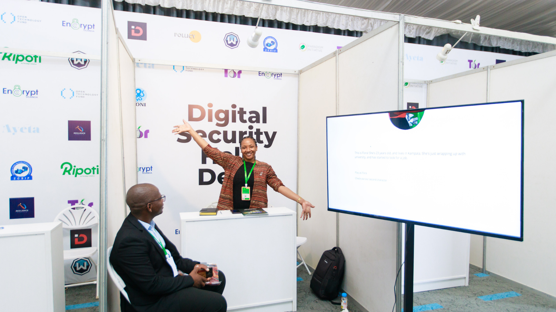 Digital Shield Africa representative speaking with a Ghanaian government official during the International Digital Security Workshop in Accra, Ghan